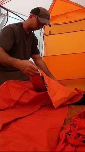 Inflating the Big Agnes Air Core Ultra Air Pad with provided inflation sack.