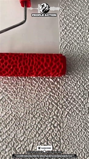 Worker Hand Rolls Pattern Evenly With Controlled Pressure And Motion
