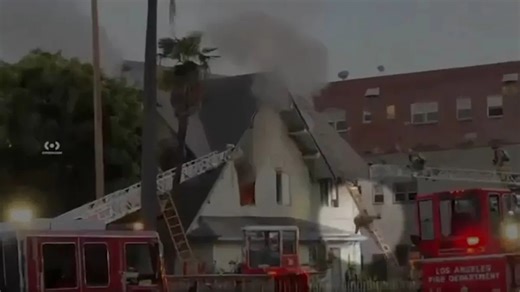 Shocking video shows LAFD firefighter fall from ladder while battling Arlington Heights house fire