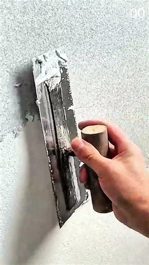 Painted wall shows texture shift smooth below rough above