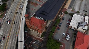 Richmond, VA downtown architecture with historic Main Street Station beside traffic passing through town on Interstate 95