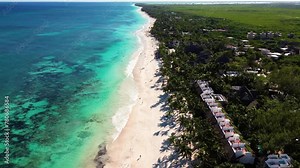 Beautiful sandy beaches in sunny Tulum in Mexico and clear blue water of the Caribbean sea close to Cancun and Playa del Carmen, a perfect vacation destination - Aerial shot drone fly by