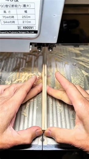 Guiding wood through vertical band saw blade