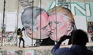 WATCH: West Bank graffiti depicts Netanyahu and Trump locking lips