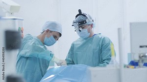 Operation of removing tonsils, tonsillectomy under deep anesthesia, using latest devices, cold plasma method, cuts swelling in throat, doctor works with new probe, medical headlamp, surgical loupes