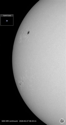 The corresponding view in white light, showing several active regions -1.3.26