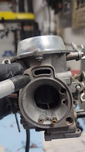 How to double check the throttle slide diaphragm and spring are seated correctly. Check for smooth oreration 1st and listen for crunching. If so, Bad. 2nd blow into or use compressed air to verify slide operation. CAUTION: DO NOT put the tip of the air nozzle directly into the atmospheric vent. The pressure is too great! You can damage the slide. With a proper seal blowing by mouth works. | Westside Motorsports