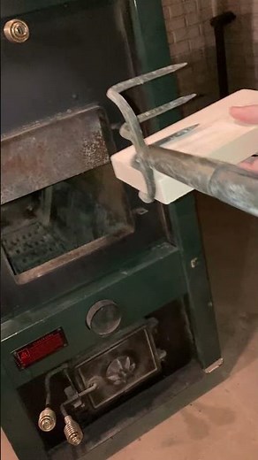 Installing fire bricks in Clayton wood/coal burning furnace