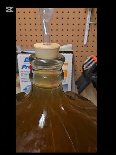 DIY EM-1 effective microbes part 1. 1/3 cup molasses and 1/3 cup EM-1. fill with warm water.