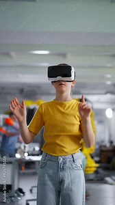 Video of schoolgirl with VR headset on head. Children learning robotics in Elementary school, using modern technology, virtual reality.