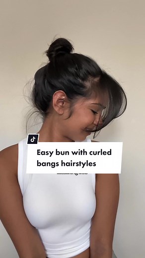 Cute and easy bun with curled bangs hairstyles. Let me know what other hairstyles you want to see next! #bunhairstyles #curtainbangs #easyhairstyletutorial #fallhairtrends #bunhairstyletutorial #curtainbangshairstyle #hairinfluencer