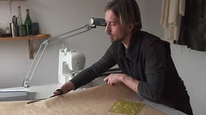 Fashion designer cutting a pattern for a dress - Free Stock Video