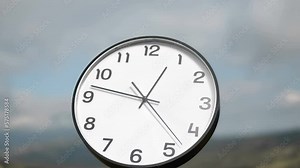 Vintage clock time running out timelapse with clouds motion in background,time flow loop concept, 4K