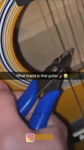 Cutting Guitar Strings with Blue Pliers: A Close-Up