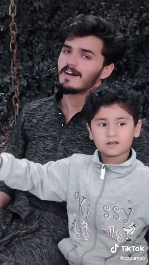 Playful Swing Time: An Adult and Child's Joyful Bond