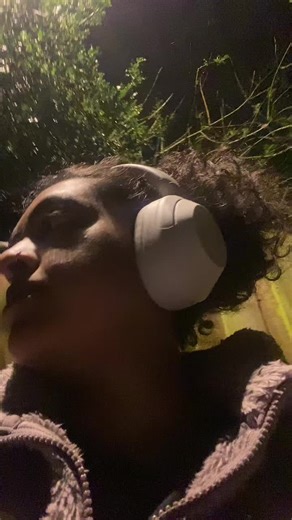 Grown woman crosses medium sized puddle