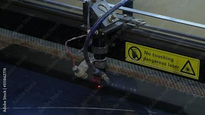 Laser cuts numbers and letters for car numbers on plastic with double-sided tape. Production of 3D numbers for cars. Focused, computer-controlled laser beam provides a high concentration of energy an