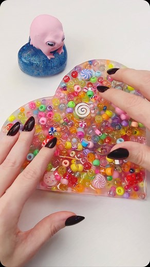 Absolutely gorgeous picky pad for Valentines Day! I found this one at the Fidget Picks Shop on Etsy. #pickypad #pickpad #beads #asmr #doctorsquish | Doctor Squish