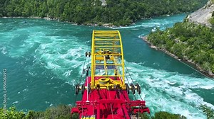 Niagara Falls, ON, Canada-June 30, 2022: A Whirlpool Aero Car over the whirlpool of the Niagara River is shown. The Whirlpool Aero Car is one of the Niagara Falls tourist attractions.