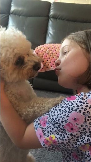 Dog kisses ruby on the lips!