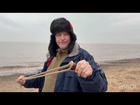 Shepherd's sling on a beach.