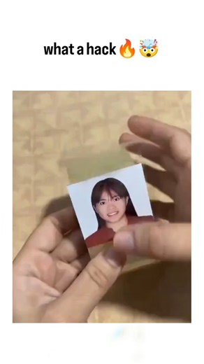 explainingproduction on Instagram: "The post demonstrates a DIY lamination hack using clear tape to waterproof and protect ID photos, shown step-by-step on a school portrait: adhere the image face-down to tape, fold over to seal, and trim edges with scissors for a bubble-free finish. Shared by @rofmeov , a fan account dedicated to NCT's Jaehyun, the video amassed over 1.4 million views within hours, drawing praise in replies for its simplicity and satisfying result, particularly among Indonesian