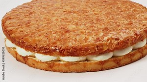 Bee sting cake, light cake with cream filling, with crispy almonds