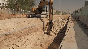 Powerful Hydraulic Hammer Crushing Rocks in Construction Site