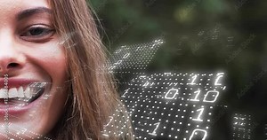 Mid woman framing face as binary grid forming and rotating, fueling smile in tech demo
