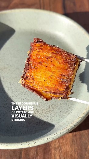 There are about a million layers (give or take) of thinly-sliced, tender potatoes in every bite of @alexaweibel’s Potato Pavé With Parmesan Crust. Get the recipe at the link in bio! | NYT Cooking
