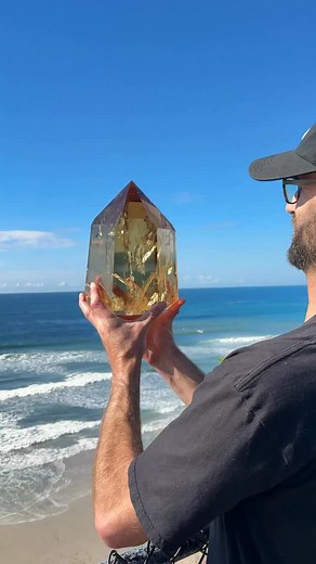 The Ultimate Citrine👑💎✨ 26 lb of pure golden beauty with exceptional clarity and the most warming natural tone glowing over the Pacific Ocean on a sunny Fall day.🌞✨ | Rocks for the Spirit
