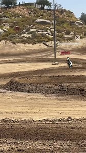 Jeremy McGrath going wide open at Perris Raceway on his Kawasaki KX250 for the Maxxis Tires intro day for their new SI “soft intermediate terrain” and IH “intermediate hard terrain” tires | Motocross Action