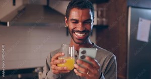Man, phone and glass of juice in home, night and smile for texting, communication or funny meme on web. Person, smartphone and happy with healthy drink, click and reading notification on social media