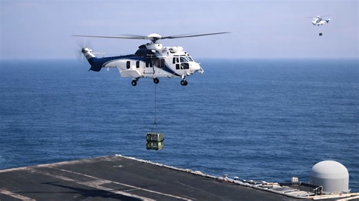 US Navy ships transfer fuel and supplies at sea