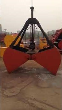 How does a clamshell crane grab work?