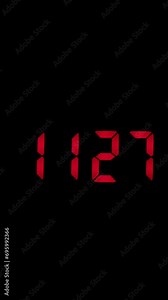 Vertical time lapse of a digital alarm clock time passing over a day to night.