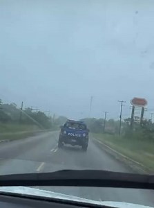 BBN community, how do you feel about the situation involving the two individuals being transported in the rain? | Breaking Belize News