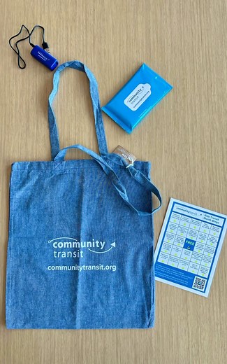 Take a peek into our Ride Transit Month Grand Prize bag! We’re including some awesome Community Transit gear, including a tote bag, safety flasher light, mini power bank, sanitizer wipes, a limited-edition Swift Green Line pen, stress ball, AND ORCA card (loaded with one month’s worth of riding). Best of all, you’ll get the Community Transit Ride Transit Month shirt! We’ll be giving away two Grand Prize pack per week (one for the “Share your ride” and one for the Transit Bingo). You have four ch