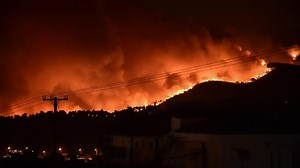Greece 'a powder keg' as wildfires kill 1 and cause thousands to flee
