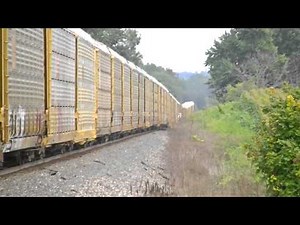 A very long CSX autorack train over 9,943 ft long almost 2 miles with loaded autoracks