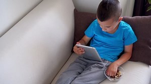 Concentrated Boy Using Tablet While Eating Stock Footage Video (100% Royalty-free) 1012118396 | Shutterstock