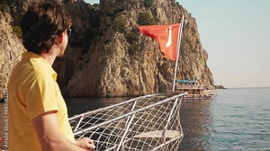 a yacht sails the Mediterranean, revealing Turkey's coastal allure in a luxurious maritime escapade