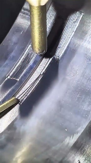 welding two metal surfaces together by creating precise parallel lines with a handheld electric tool