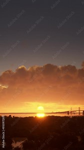 Aerial drone footage of the Chesapeake Bay Bridge in Maryland at sunset with a front and slow camera movement. United States of America