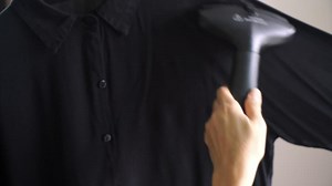 iron clothes with steam iron