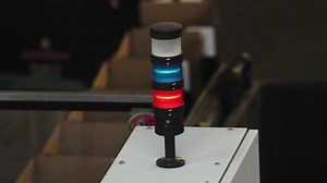 clip-1011658970-warning-light-blinking-on-stopped-factory-machine