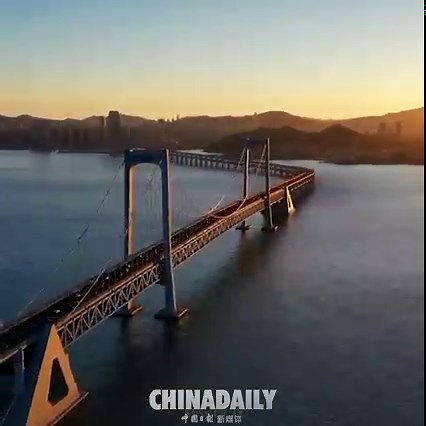 Xinghai Bay Cross-Sea #Bridge in Dalian is a gorgeous sight against the backdrop of golden sunlight. | China Daily