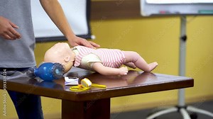 Baby first aid training. First aid training to giving cardiopulmonary resuscitation to child