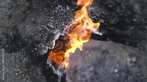 Wonderful unique natural phenomenon with release of methane and ignition from static electricity on famous Yanartas mountain between stones extreme close view.