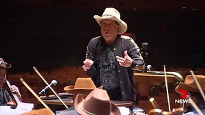 Music guru Molly Meldrum today became a maestro, fulfilling a childhood dream by conducting the Melbourne Symphony Orchestra. Molly's still recovering from his near fatal fall six years ago and this surprise was a big thank you for all his hard work for the Arts Centre Melbourne. www.7plus.com.au/news #7News | 7NEWS Melbourne